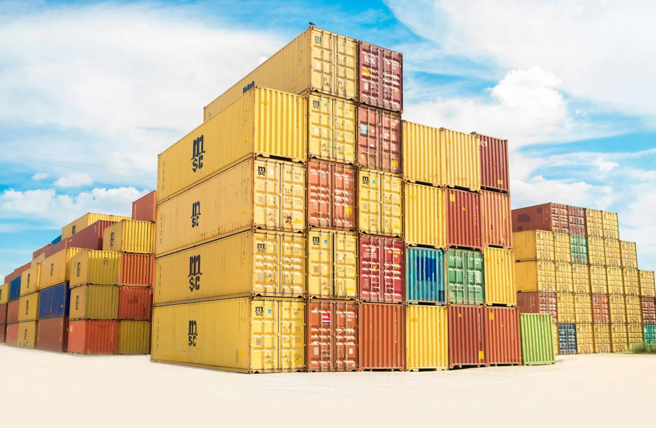 Golden yellow shipping containers — illustrative trade photography